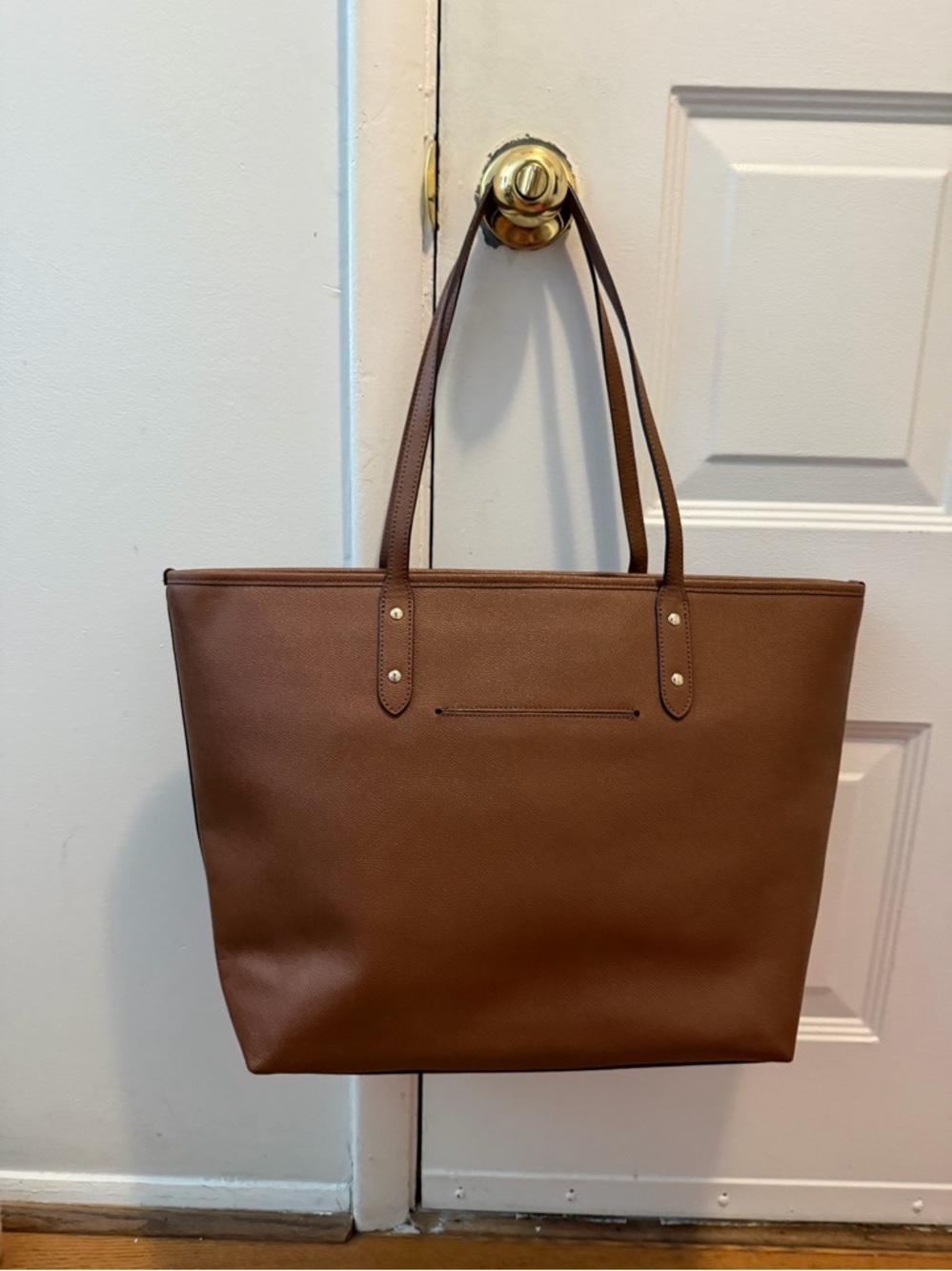 Coach City Zip Tote in the color Saddle Brown. - Picture 2 of 5